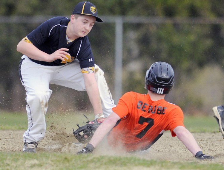 Gardiner’s Nic Berube is tagged at second base by Marancook’s Matt Gyorgy on Tuesday in Gardiner.
