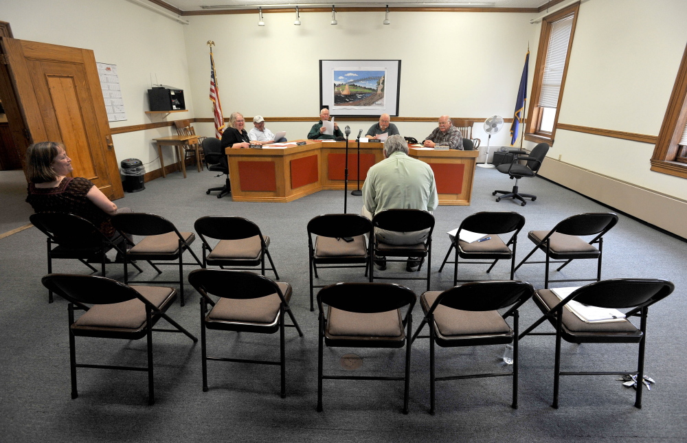 The Skowhegan Board of Assessors meets to finalize and formalize the vote by the board to deny a requested tax abatement for the Sappi paper mill at the Skowhegan Municipal Building on Thursday.