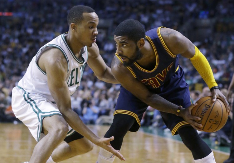 Boston Celtics guard Avery Bradley, left, tries to keep pressure on Cleveland Cavaliers guard Kyrie Irving, right, who looks for an opening in the third quarter last week in Boston. Bradley was just one of the bright spots on a Celtics roster that looks to build through the draft and free agency during the offseason.