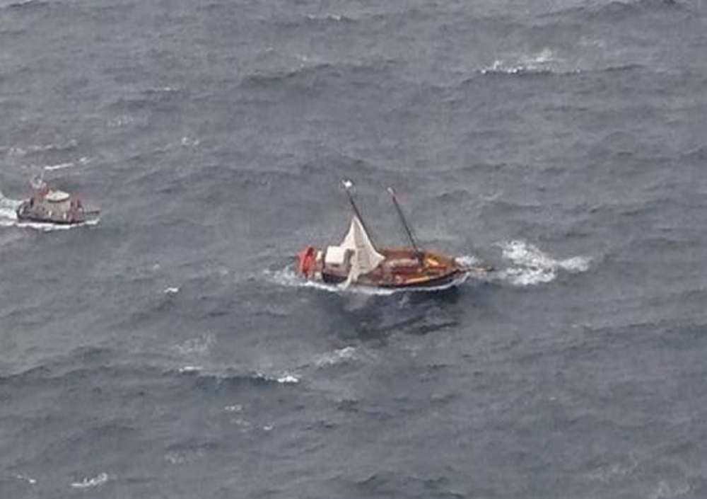 The U.S. Coast Guard cutter Ocracoke patrols in the vicinity of the drifting Liana’s Ransom off the coast of York on Tuesday.