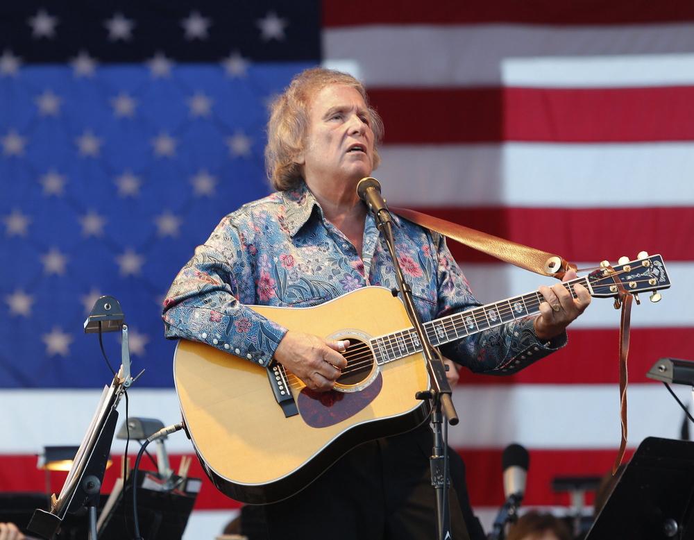 Singer/songwriter Don McLean, shown performing at a Fourth of July celebration in Portland, is auctioning off the manuscript with the lyrics to his enigmatic hit “American Pie.”