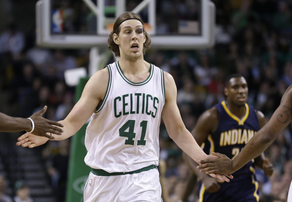 Celtics center Kelly Olynyk gets congrats from teammates during the fourth quarter Wednesday night. He scored 19 points against the Indiana Pacers, after looking like he would miss the game because of an eye injury.