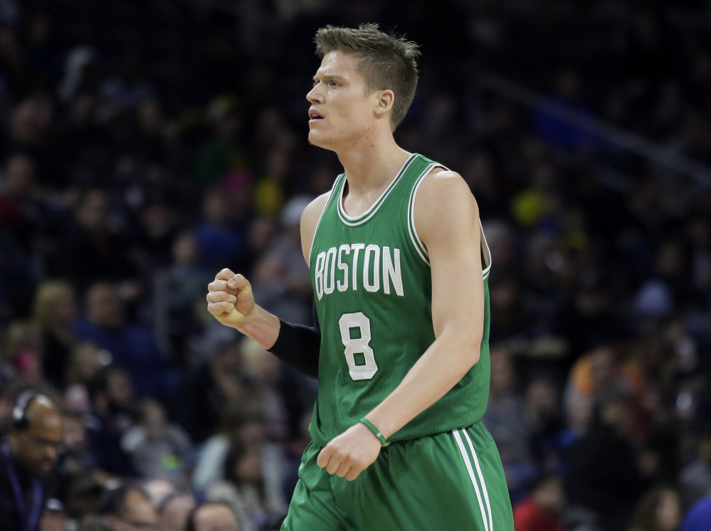 The Celtics’ Jonas Jerebko, who was traded to Boston from the Pistons this season, pumps a fist after feeding teammate Isaiah Thomas for a three-point basket to end the first quarter Wednesday night in Auburn Hills, Mich.
