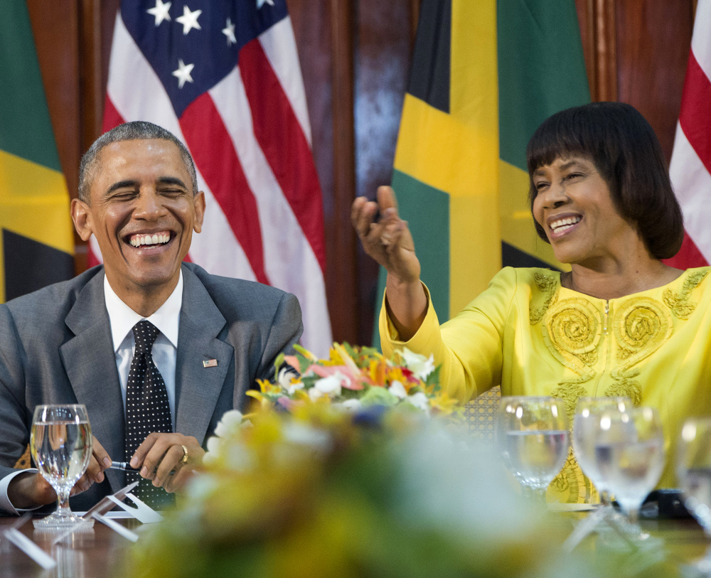 President Obama, left, shown with Jamaican Prime Minister Portia Simpson-Miller, in Kingston, Jamaica, said, “We don’t want to be imprisoned by the past” regarding Cuba.