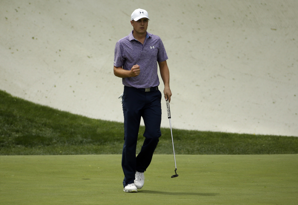 Jordan Spieth pumps a fist after yet another birdie, on the 13th hole in the second round of the Masters on Friday in Augusta, Ga. Spieth had 15 birdies and only one bogey through the first two days.