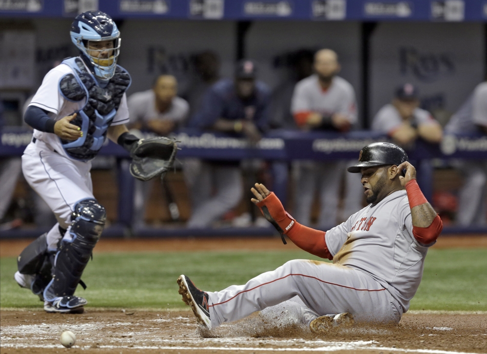 Red Sox third baseman Pablo Sandoval scores on a sacrifice fly by Daniel Nava off Tampa Bay Rays starting pitcher Jake Odorizzi in the second inning of Thursday’s game in St. Petersburg, Fla. Catching for the Rays is Rene Rivera.