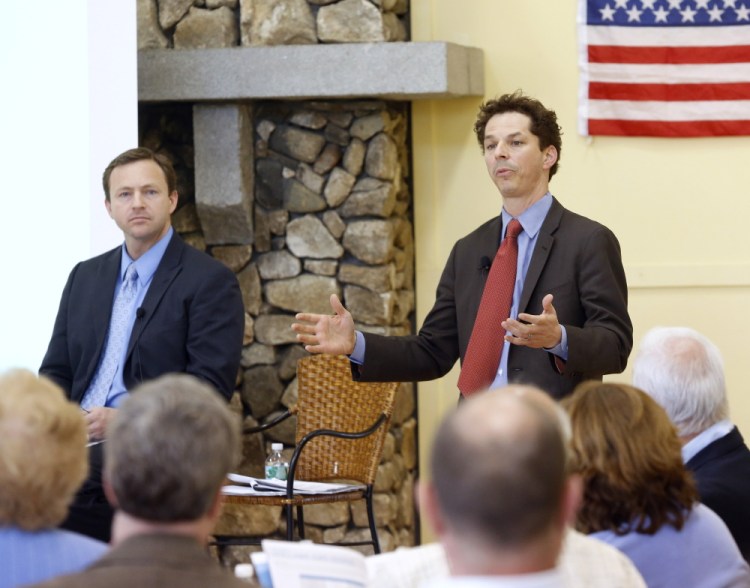 Sen. Justin Alfond, D-Portland, speaks as Democratic leaders hold a town hall meeting Tuesday night in Scarborough to discuss their plan to counter Gov. Paul LePage's proposed tax overhaul. House Speaker Mark Eves, D-North Berwick, left, listens as Alfond speaks. 
