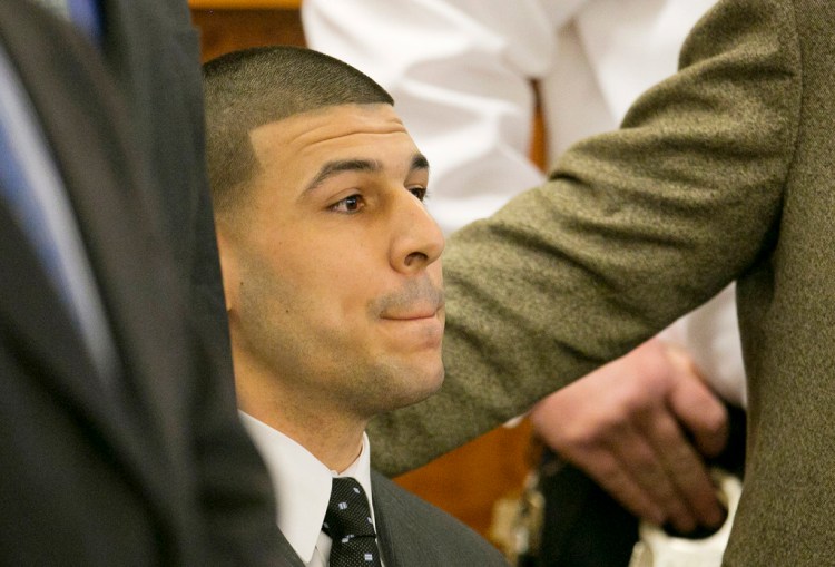 Aaron Hernandez listens as the guilty verdict is read during his murder trial Wednesday at Bristol County Superior Court in Fall River, Mass. The Associated Press