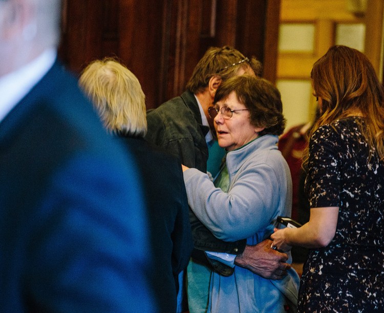 Kathleen Kelley, wife of Leon Kelley, and William Kelley, brother of the victim, hug after Merrill "Mike" Kimball is found guilty of Leon Kelley's murder on April 15. Kathleen Kelley is seeking $1 million from Kimball in a wrongful-death lawsuit.
