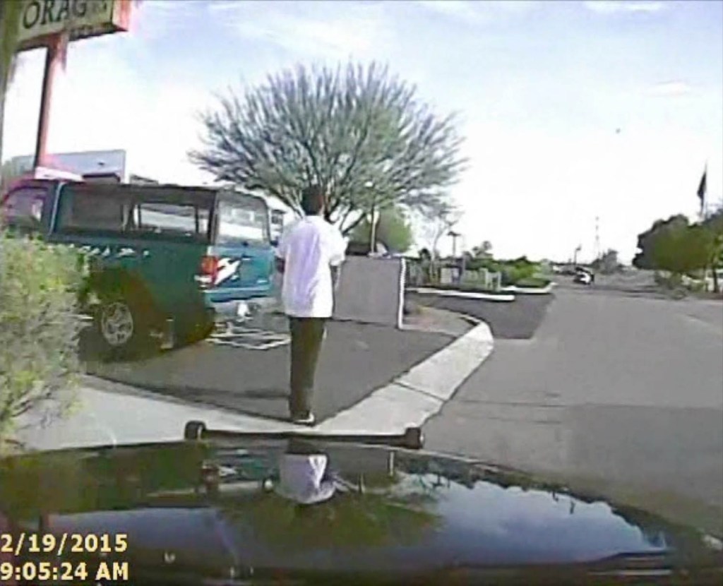 This frame from a dash cam video taken Feb. 19 and provided by the Marana Police Department shows a police officer using his cruiser to ram an armed suspect, sending him flying before the car smashes into a wall. The man survived the crash, and prosecutors cleared the officer of any wrongdoing. 
Marana Police Department via Associated Press
