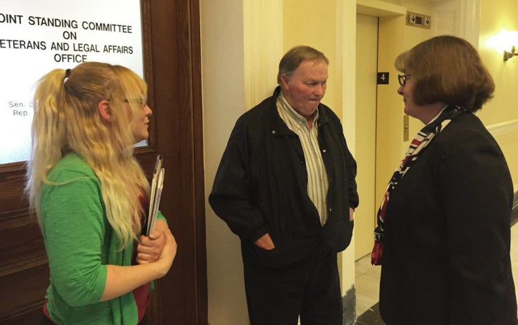 Jenny McPherson, left, and her father, Craig McPherson Sr., speak with Rep. Stacey Guerin about a bill to criminalize driving while extremely tired. Craig McPherson Jr. died in a car crash in Windham March 9, 2014, when his car collided with a car driven by someone who was allegedly fatigued. David Hench/Staff Photographer