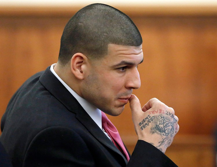 Former New England Patriots player Aaron Hernandez sits in the courtroom during his murder trial Thursday. He is charged with killing Odin Lloyd in June 2013. Hernandez's defense has characterized the police investigation in the case as bumbling and claimed that Hernandez was targeted as a suspect because he is a celebrity. The Associated Press