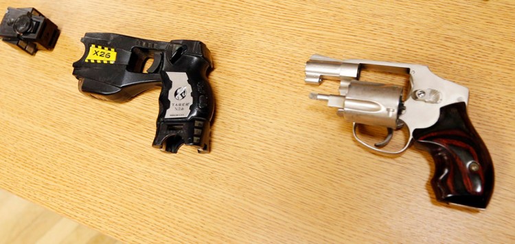 This Taser and handgun are similar to the weapons carried by Tulsa County reserve deputy Robert Bates when he fatally shot Eric Harris. The Associated Press