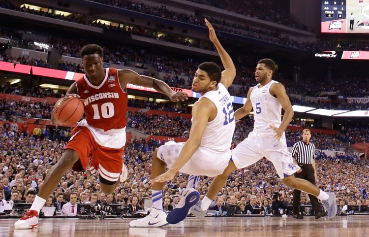 Wisconsin's Nigel Hayes (10) drives against Kentucky's Karl-Anthony Towns during the second half of the NCAA Final Four semifinal game Saturday in Indianapolis. The Associated Press