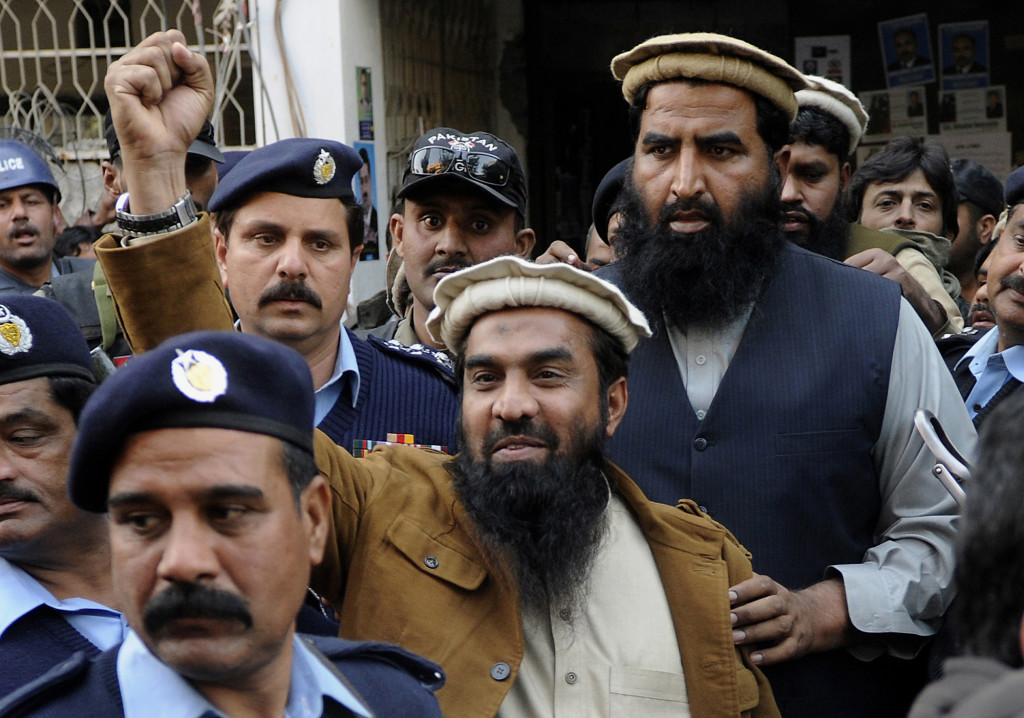 Zaki-ur-Rahman Lakhvi, the main suspect of the Mumbai terror attacks, raises his fist after his court appearance in Islamabad, Pakistan in January 2015. The Associated Press