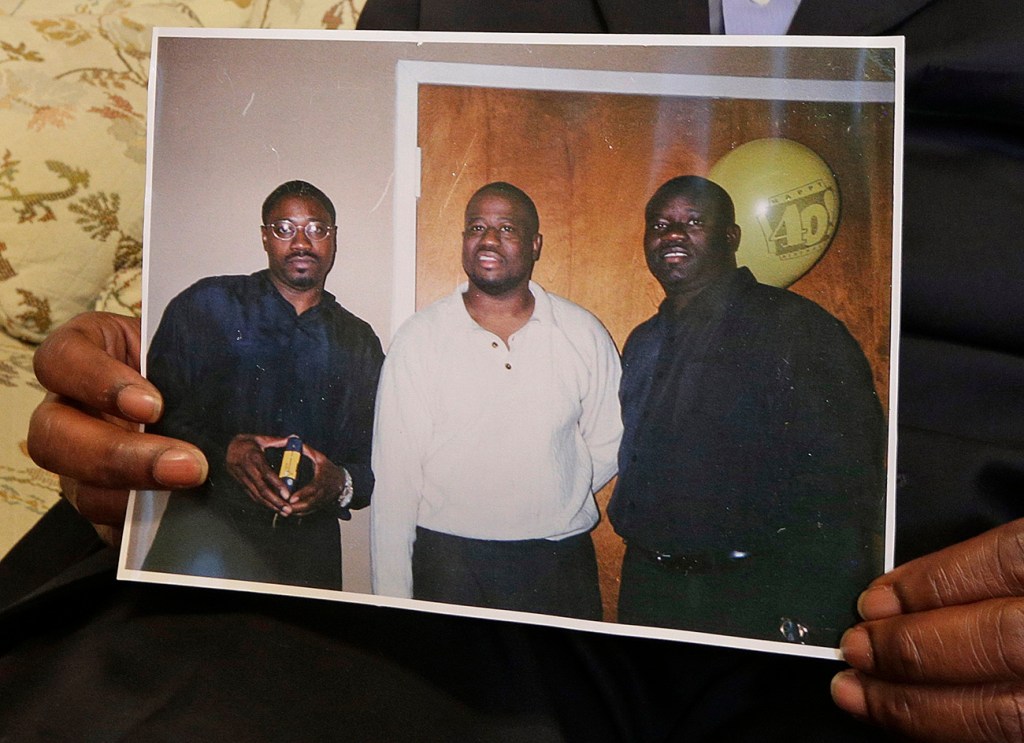 The Scott brothers in a family photo: shooting victim Walter is on the  left; Anthony is in the  center, and Rodney is at right. The Associated Press