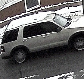 Three men who robbed two Portland residents in their home Thursday drove this tan Ford SUV shown in a surveillance image. 