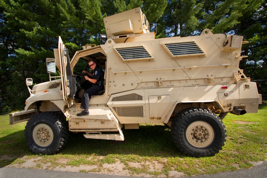 Sanford Police Chief Thomas Connolly steps down from the department's Mine-Resistant Ambush Protected vehicle last summer. A new executive order from the Obama administration reins in the use of such military equipment by local police departments. 
Press Herald file photo