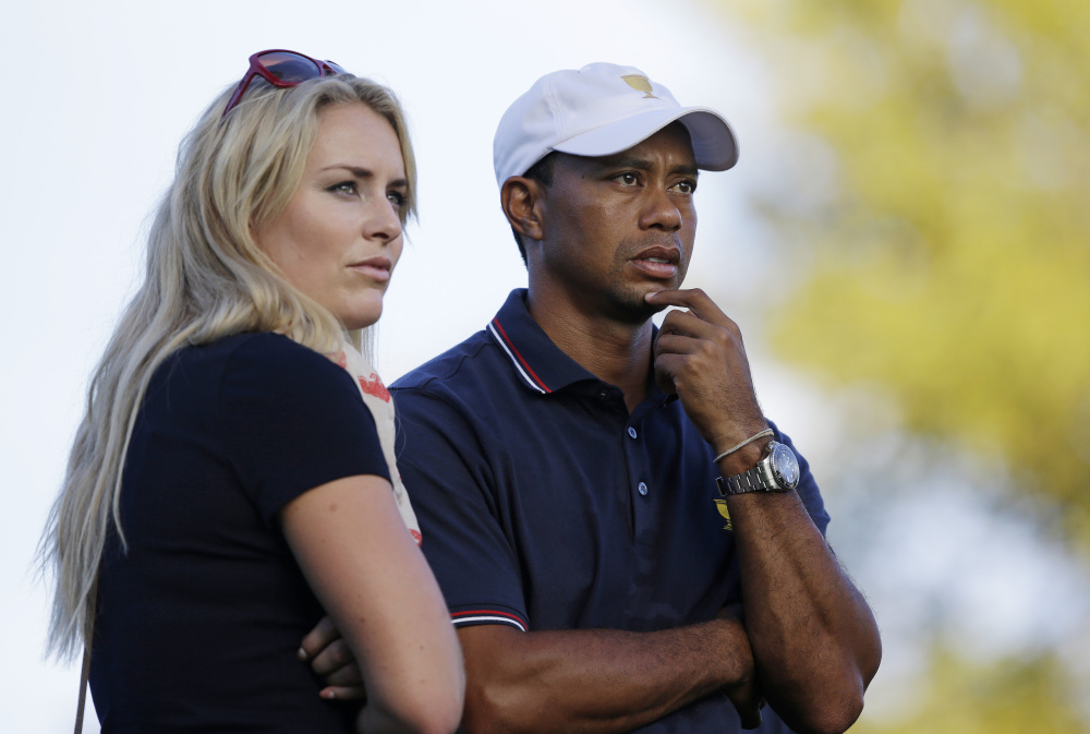 The Associated Press Tiger Woods watches with his girlfriend Lindsey Vonn at the Presidents Cup golf tournament at Muirfield Village Golf Club in Dublin, Ohio, in October 2013. Vonn announced on Sunday that she and Woods have decided to end their three-year relationship.