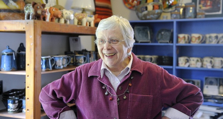 Barbara Loken greets guests Sunday at her pottery studio, located behind her Farmingdale home. Loken Pottery was open for tours during the Maine Pottery Tour, along with several other shops in Maine.