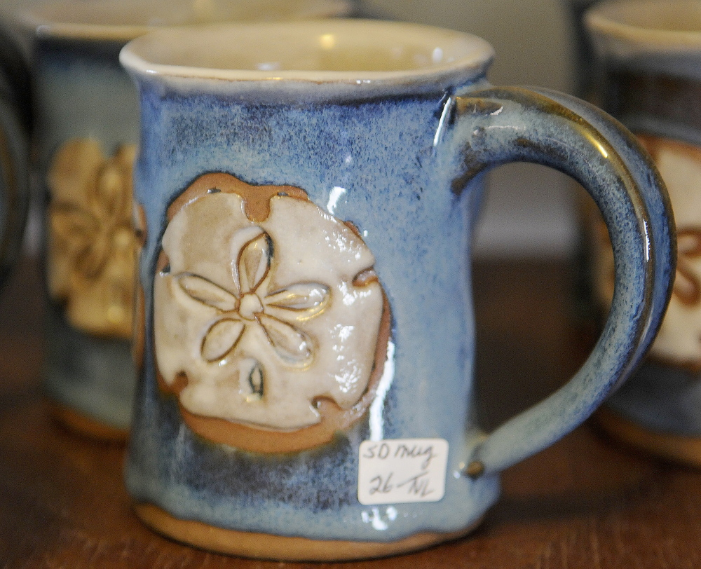 A mug stands on display Sunday at Loken Pottery in Farmingdale. Barbara and Neal Loken opened their studio for tours during the Maine Pottery Tour, as did several other shops in Maine.