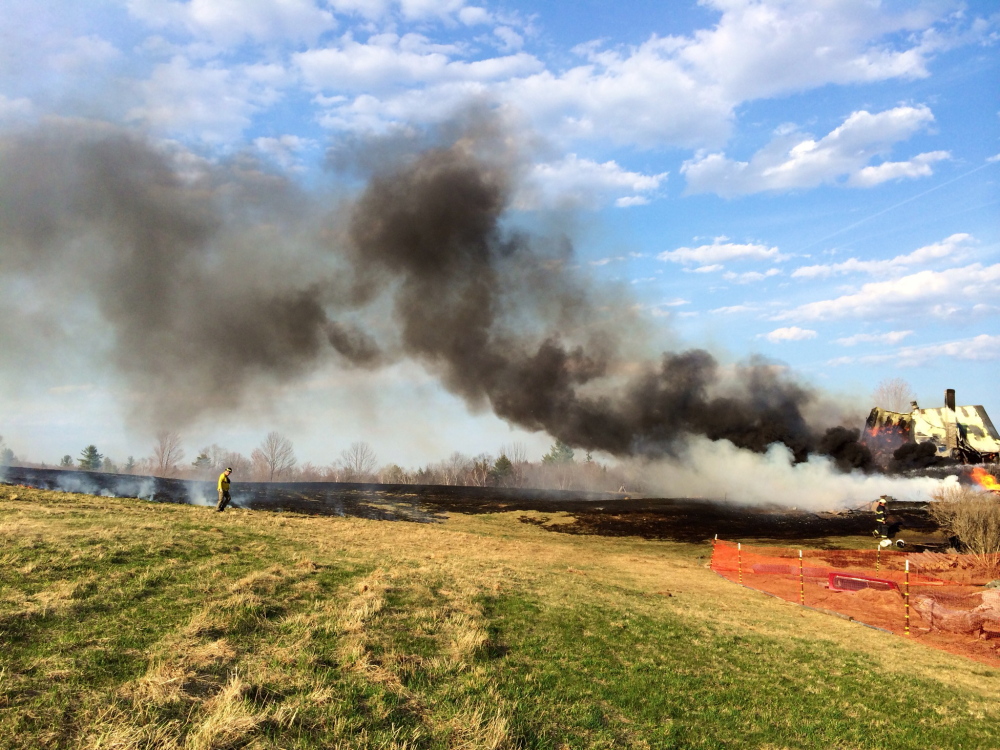 A fast-moving fire in a house in Solon was threatening to spread to an adjoining field late Monday afternoon.