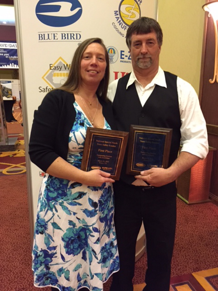 Drivers Lisa Gadway, left, and Gregg McGoff, from the Maine School Administrative District 49, earned first place for their performance in the 18th annual National Special Needs Team Safety Roadeo.