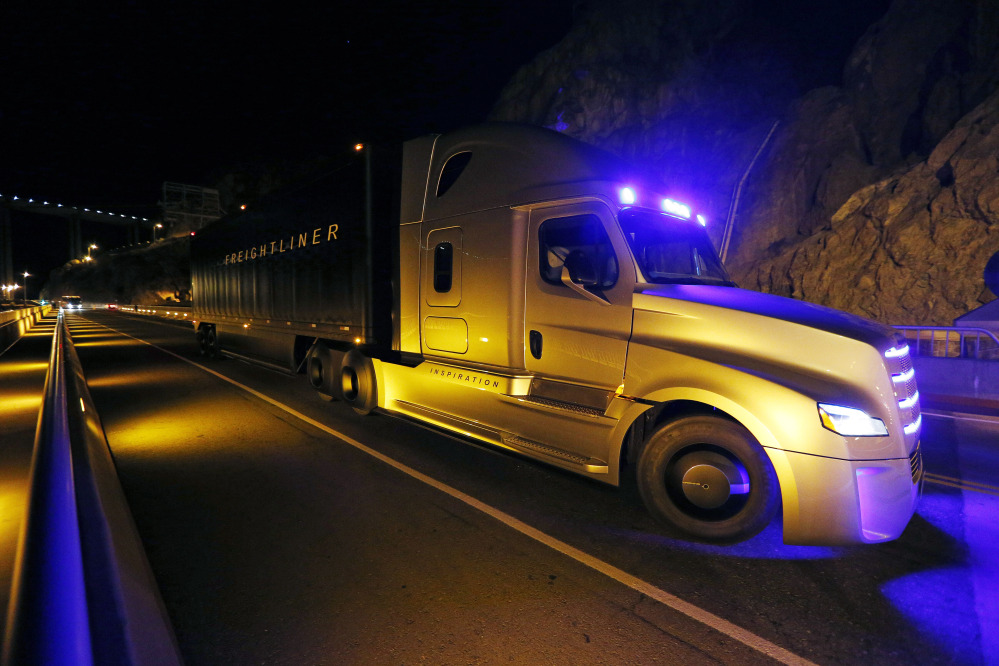 Freightliner unveils its Inspiration self-driving truck during an event at the Hoover Dam Tuesday near Boulder City, Nev.