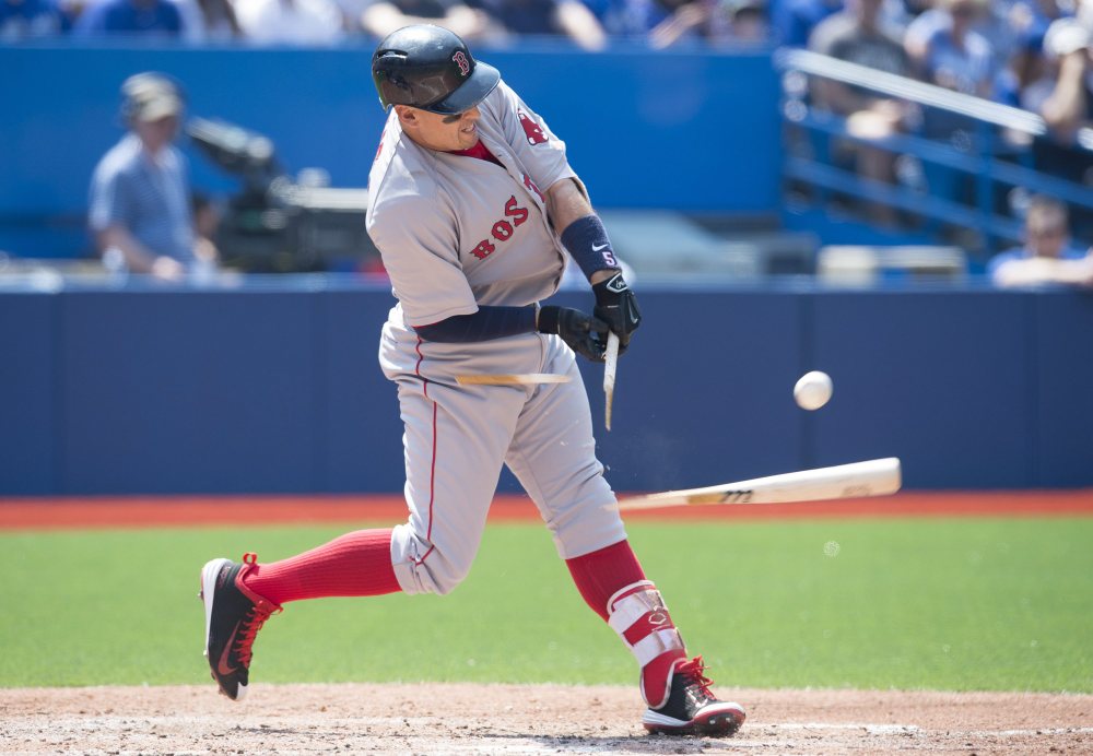 Boston Red Sox’ Allen Craig shatters his bat while popping out during fourth inning of Saturday’s game against the Toronto Blue Jays in Toronto. The Blue Jays won 7-1.