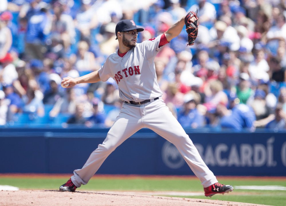 Boston Red Sox starting pitcher Joe Kelly works against the Toronto Blue Jays during first inning of Saturday’s game in Toronto. The Blue Jays won 7-1.