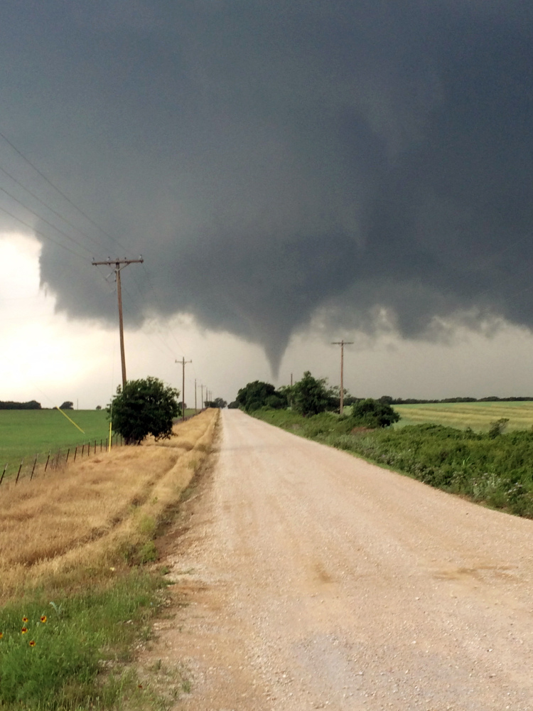 In this Saturday photo provided by Brian Khoury, a tornado touches down in Cisco, Texas.