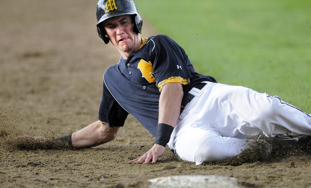 Maranacook’s Cam Brochu slides into third base during a game Tuesday afternoon against Camden Hills in Readfield. Camden scored six runs in the top of the seventh to earn an 8-4 victory.