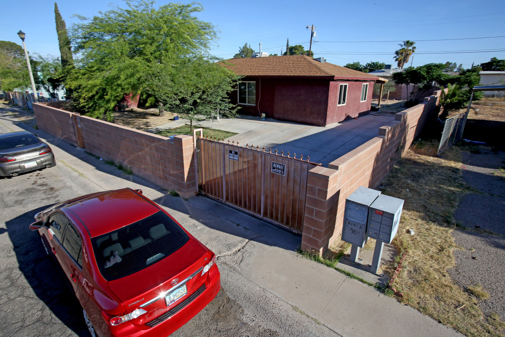 Police say five people were shot to death in a reported murder-suicide Tuesday evening at this home on the 800 block of West Calle Medina, Tucson, Ariz., shown Wednesday.