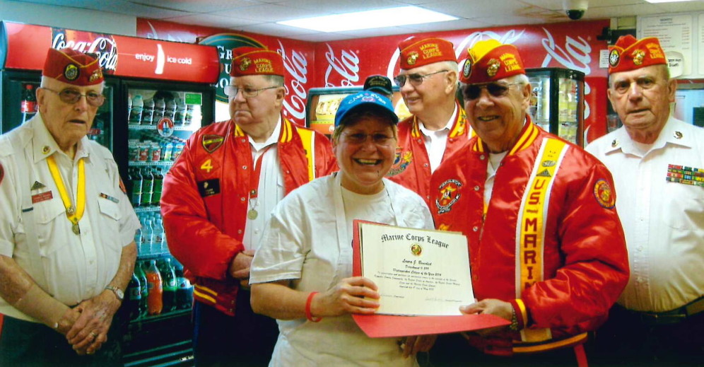 Laura Benedict was honored as the 2014 Citizen of the Year Friday, May 8, by the Kennebec Valley Marine Corps League Detachment 599, Augusta. Benedict, owner of The Red Barn in Augusta, was selected for her selfless dedication to serving her community and holding to the highest ideals of the United States Marine Corps League, according to a news release from the detachment. Said by every member, she is truly a very giving person and the award is well-deserved, according to the release. Front, from left, is Benedict, who accepted the award certificate from John Poulin. Back, from left, are Donald Brawn, Robert Veilleux, William Schultz and Ralph Sargent.