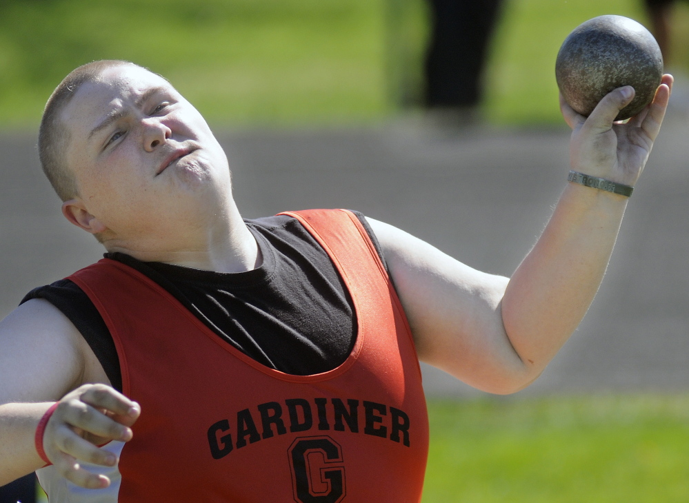 Staff photo by Andy Molloy 
 Gardiner Area High School student RJ Sullivan hurls the shot put during a track meet in Gardiner on Thursday.