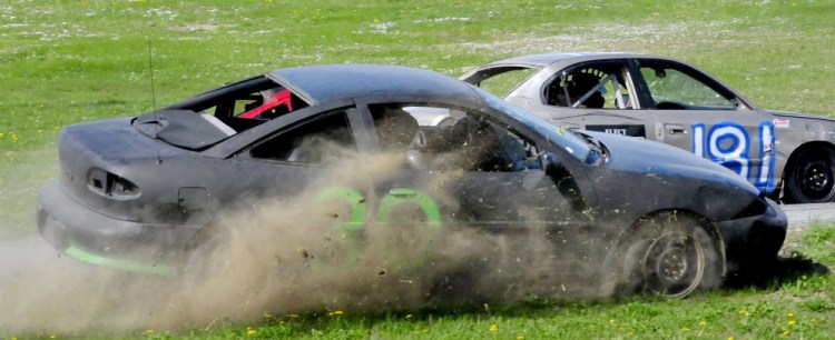 Racer John Roach spins off the track after blowing a front tire during the Super Stock Enduro race Sunday at Unity Raceway.