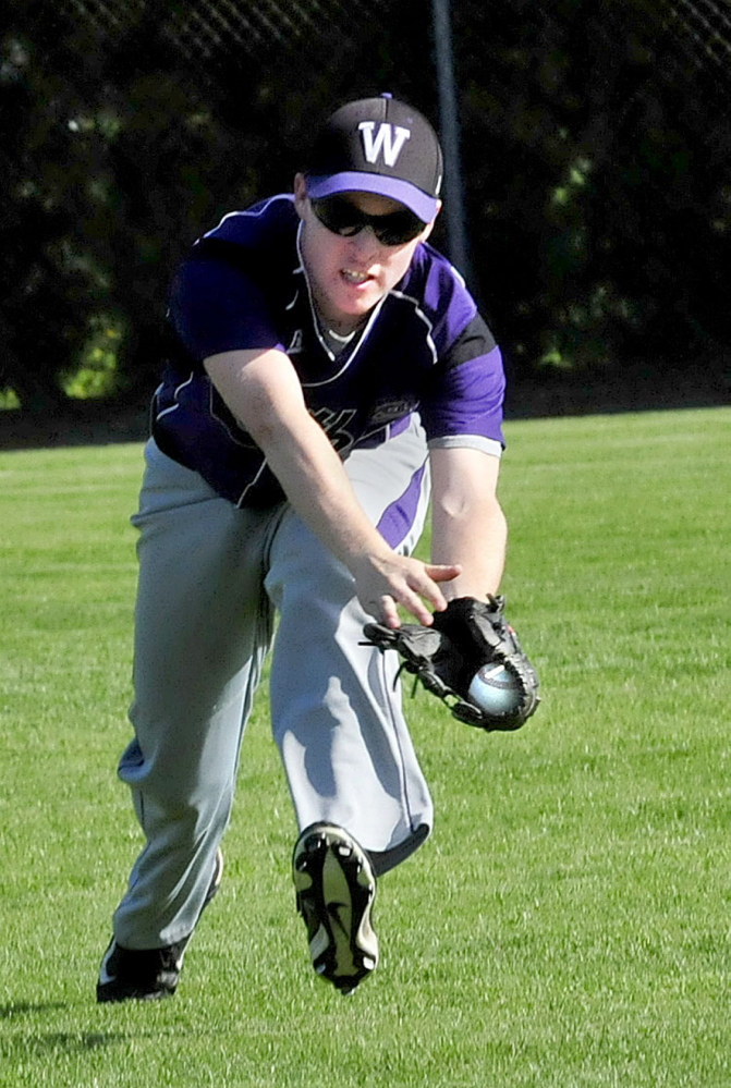 Waterville’s Cody Lyons makes the catch from a Winslow batter during a game Monday in Winslow.