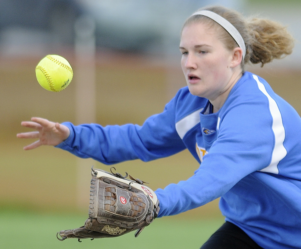 Mount Abram shortstop Abby Holland chases a line drive during a Mountain Valley Conference game Wednesday against Hall-Dale in Farmingdale. The Bulldogs rallied for a 6-5 victory.