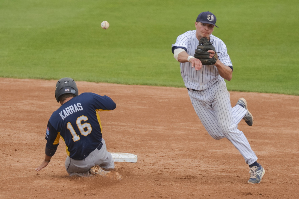 University of Southern Maine shortstop Sam Dexter makes the turn on an inning-ending double play during the second inning of a game against Emory University in the Division III College World Series last year. Dexter, a Messalonskee graduate, was named the D3baseball.com national player of the year.