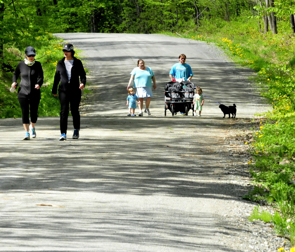 Enjoying a walk Wednesday at the Quarry Road Recreation Area in Waterville are, from left, Roxanne Pierce, Andria Mathieu, Ashley Fisher, John Notarpippo and children Damen and Abigail.