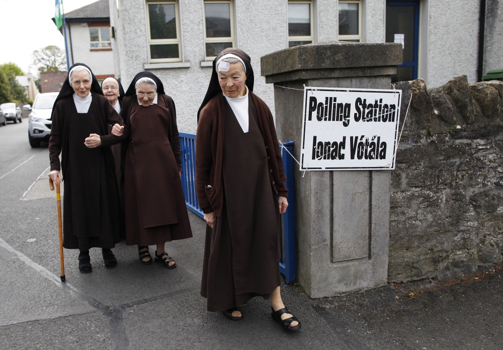 Carmelite sisters leave a polling station in Malahide, County Dublin, Ireland, Friday.