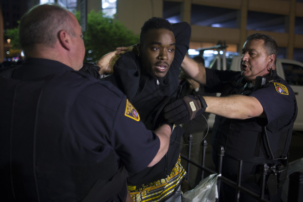 The Associated Press
A demonstrator is arrested during a protest against the acquittal of Michael Brelo, a patrolman charged in the shooting deaths of two unarmed suspects, Saturday in Cleveland.