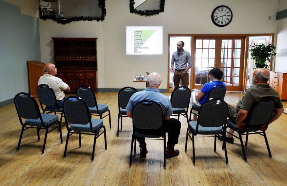 Leo Maheu, environmental educator for ecomaine, gives a presentation to attendees Tuesday at The Center in Waterville.