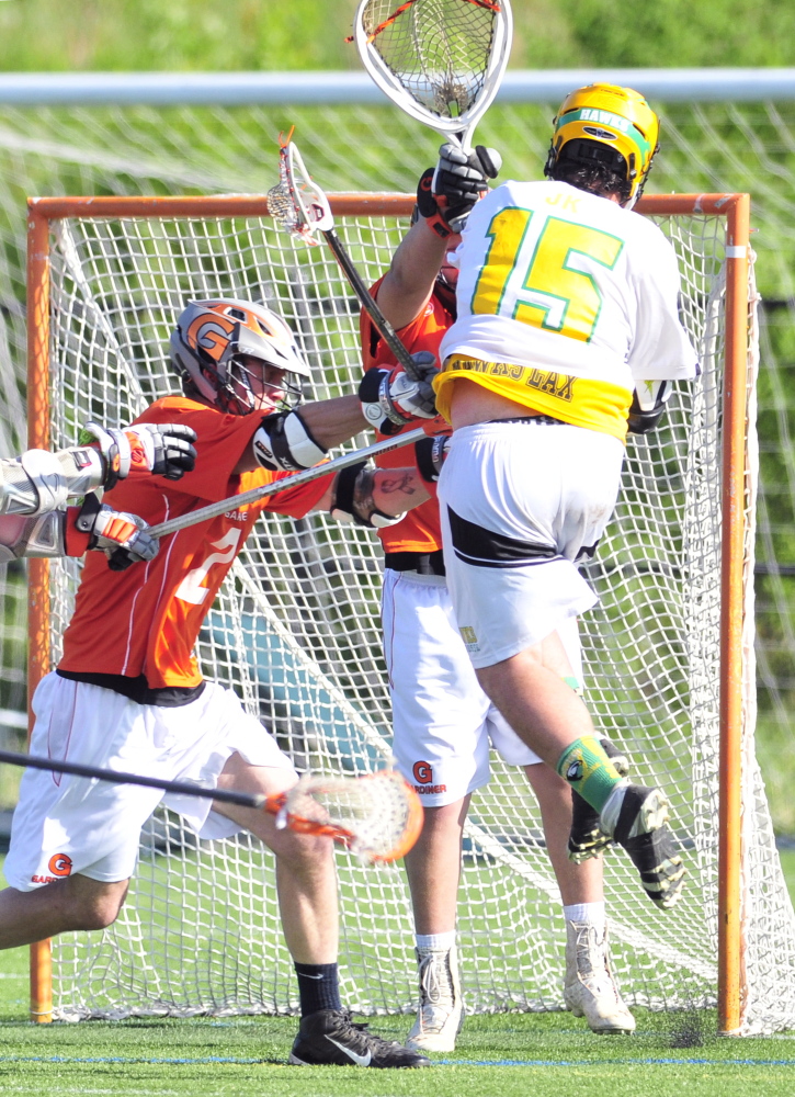 Gardiner defender Andrew Doody-Veilleux, left, and keeper Spencer King can’t stop Maranacook/Winthrop’s Ty Smith, right, from scoring during a game Friday on Huard Field at Kents Hill School in Kents Hill.