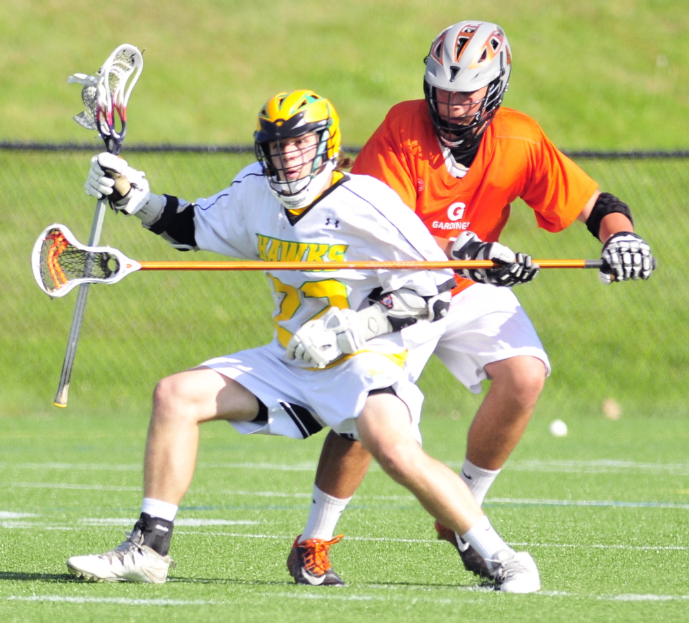 Maranacook/Winthrop’s James Canwell, left, tries to get around Gardiner defender Orion Seraph during a game Friday on Huard Field at Kents Hill School in Kents Hill.