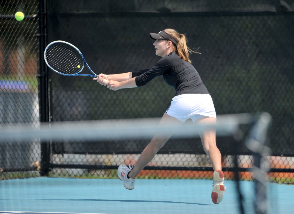 St. Dominic High School’s Bethany Hammond competes Saturday against Cheverus High School’s Natalia Mabor in the state singles championship Round of 16.
