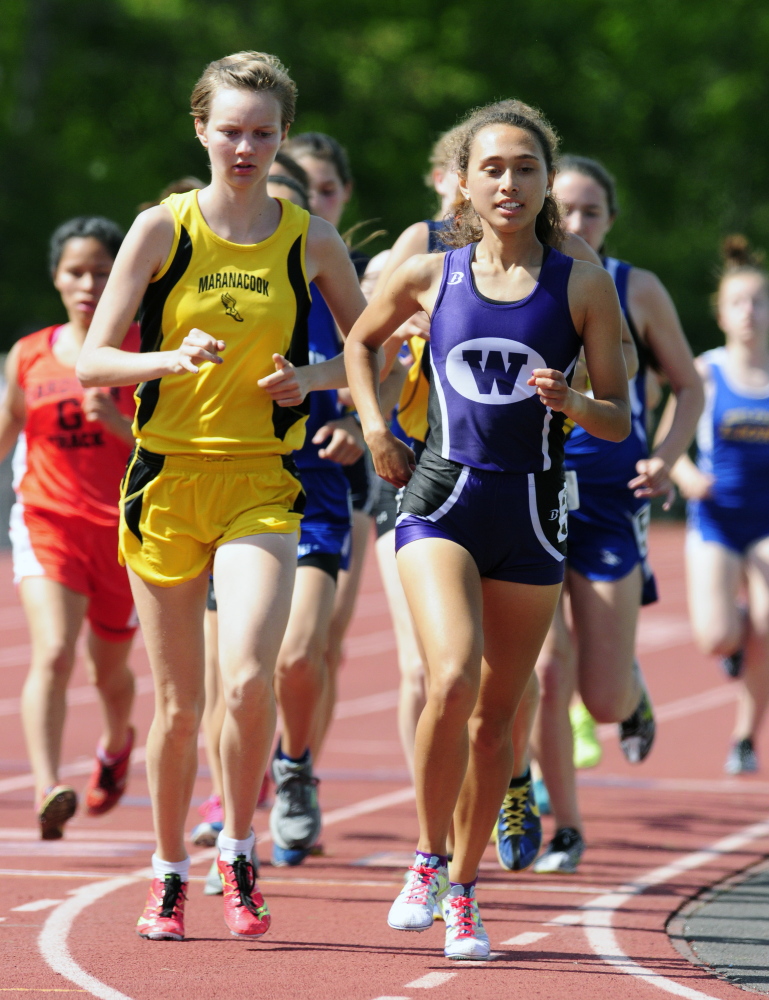 Maranacook’s Hannah Despres, left, and Waterville’s Cecilia Morin run the 3200 meters Saturday during the KVAC track meet at McCann Field in Bath.