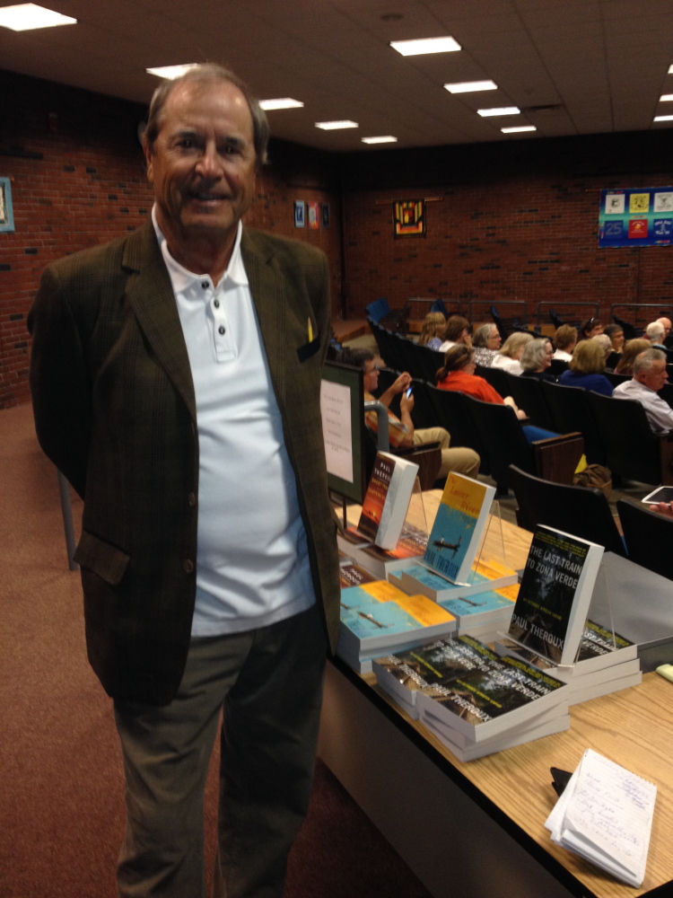 Author Paul Theroux prepares to speak to an audience Saturday at the University of Maine at Augusta’s Jewett Hall about several of his books on the table next to him. Theroux’s presentation capped off Lithgow Public Library’s A Capital Read 2015 program.