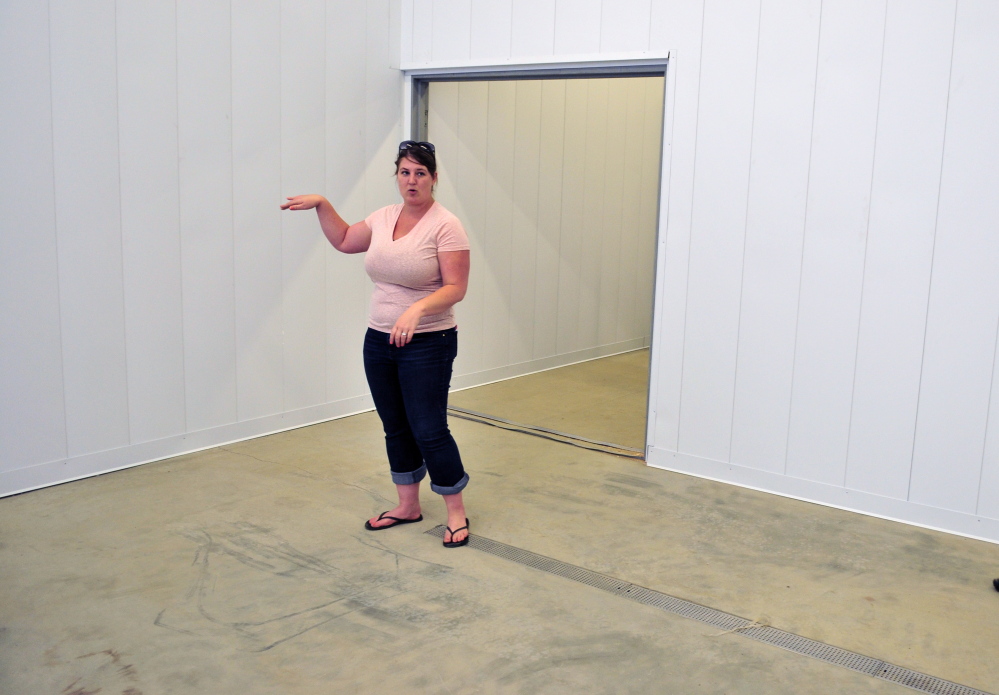 Financial administrator Jennifer Wade leads a tour on Friday of the Central Maine Meats slaughterhouse in Gardiner’s Libby Hill Business Park.