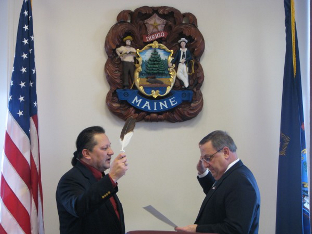 Maliseet tribal Rep. Henry Bear, left, has sponsored a bill in the Legislature that would add a constitutional amendment referendum question on the ballot this November, asking Maine voters if they wish to repeal the printing ban on redacted constitutional language in Article X, Section 5 of the Maine Constitution. At right is Gov. Paul LePage.
